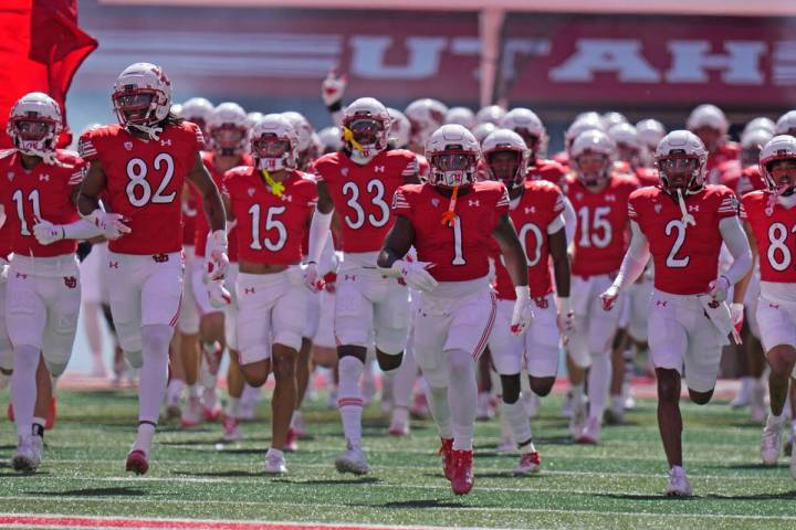 Utah players run on the field before an NCAA college football game against Utah Saturday, Sept. ...