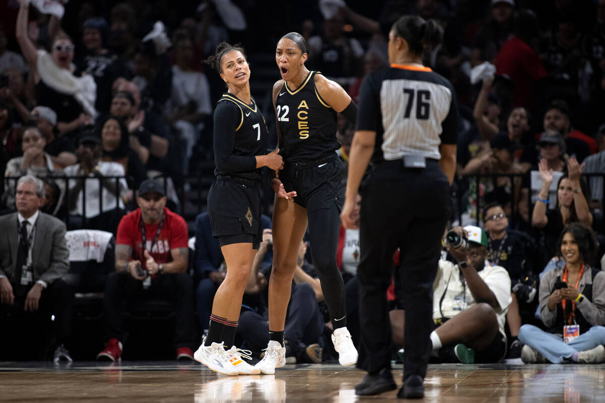 Las Vegas Aces forward A'ja Wilson (22) and Las Vegas Aces forward Alysha Clark (7) celebrate a ...