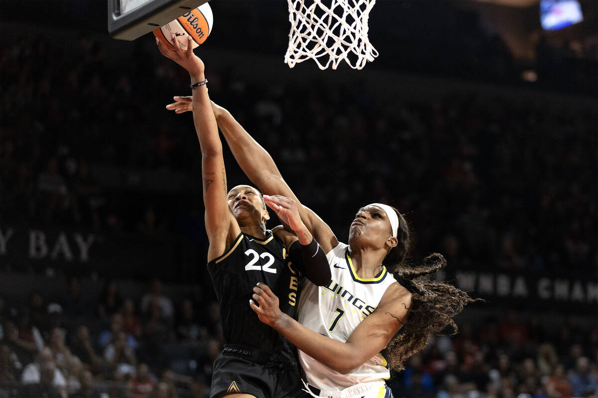 Las Vegas Aces forward A'ja Wilson (22) shoots against Dallas Wings center Teaira McCowan (7) d ...