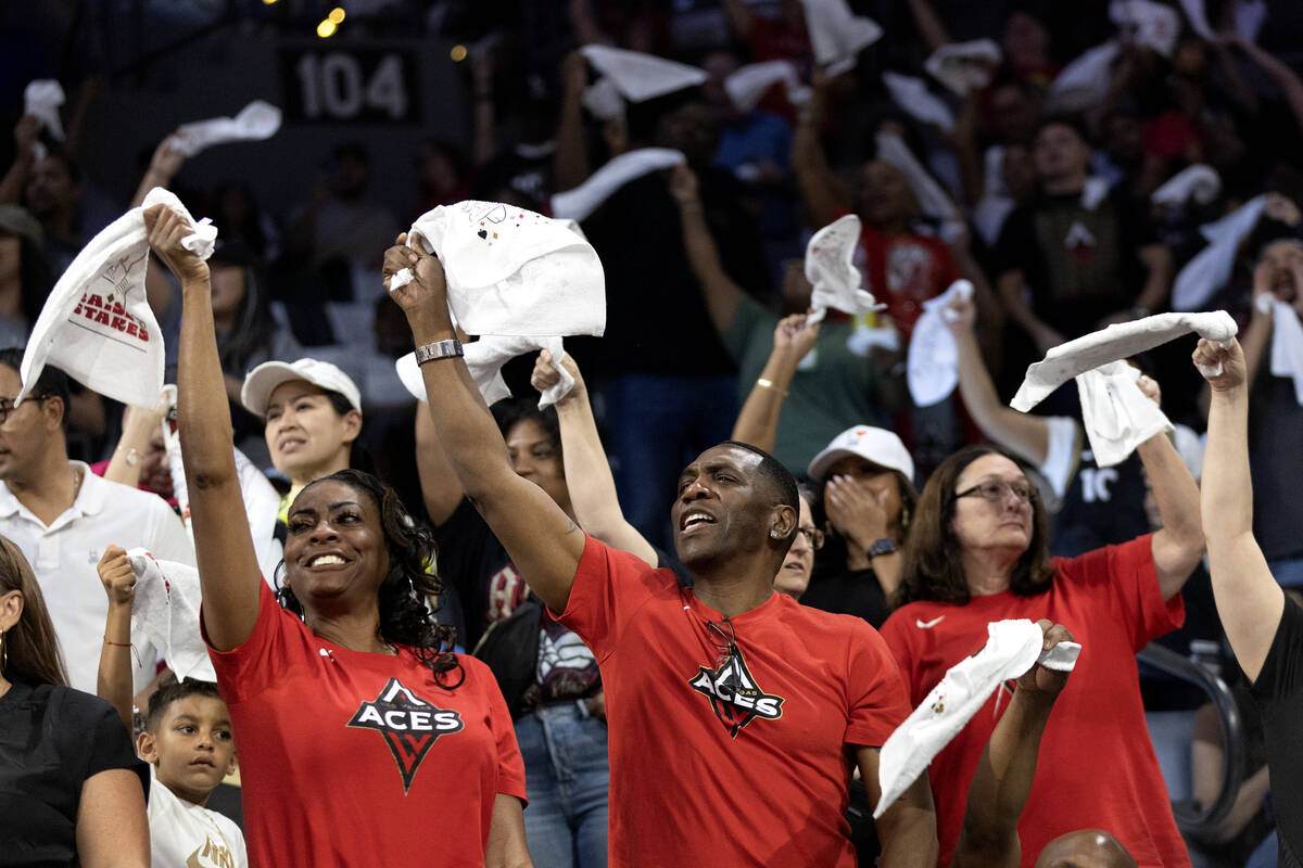 Las Vegas Aces fans wave their playoff towels during the first half in Game 2 of a WNBA basketb ...