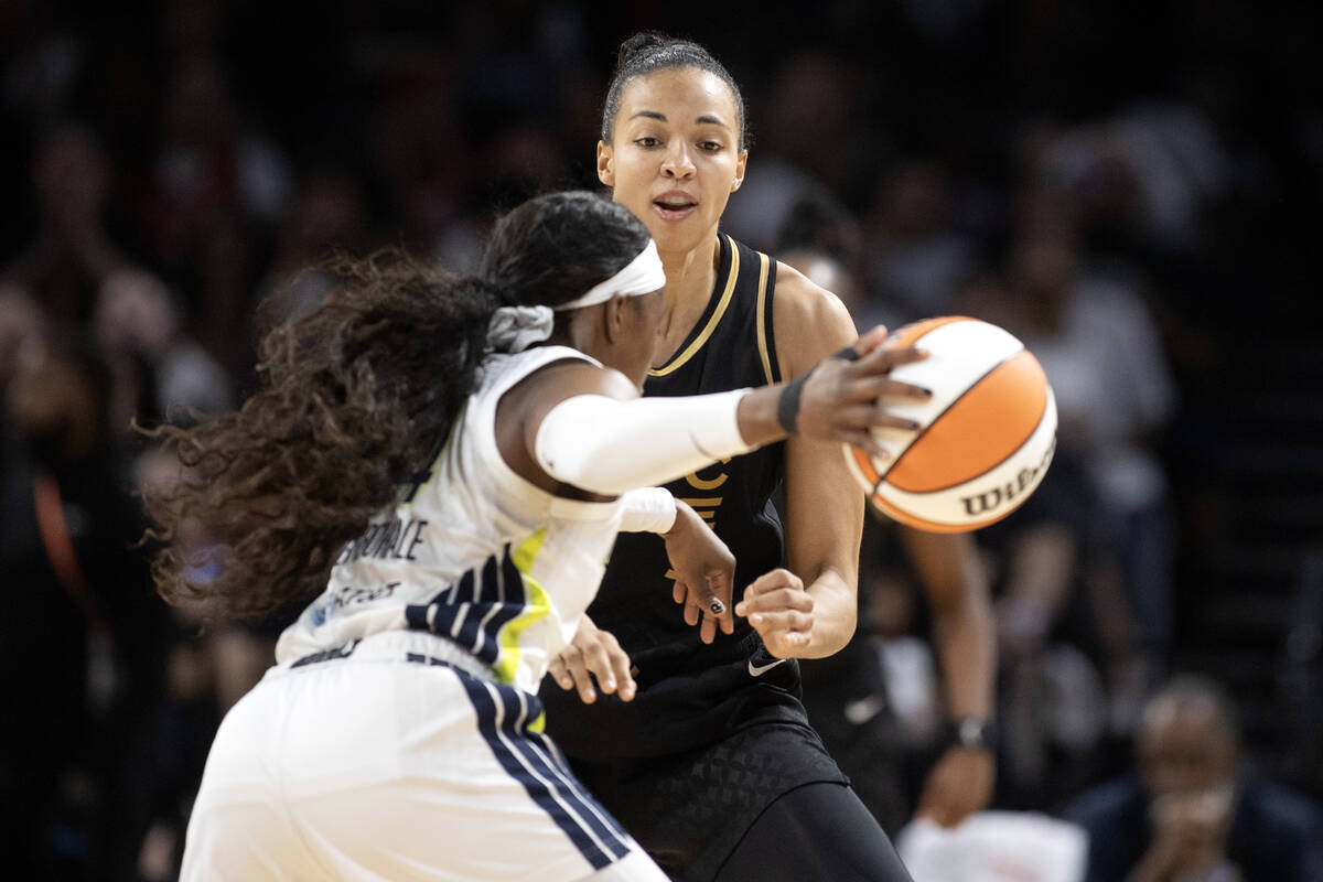 Las Vegas Aces center Kiah Stokes (41) defends against Dallas Wings guard Arike Ogunbowale (24) ...