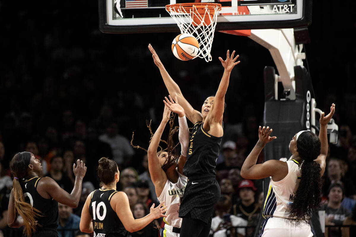 Las Vegas Aces center Kiah Stokes (41) blocks a shot by Dallas Wings forward Satou Sabally (0) ...