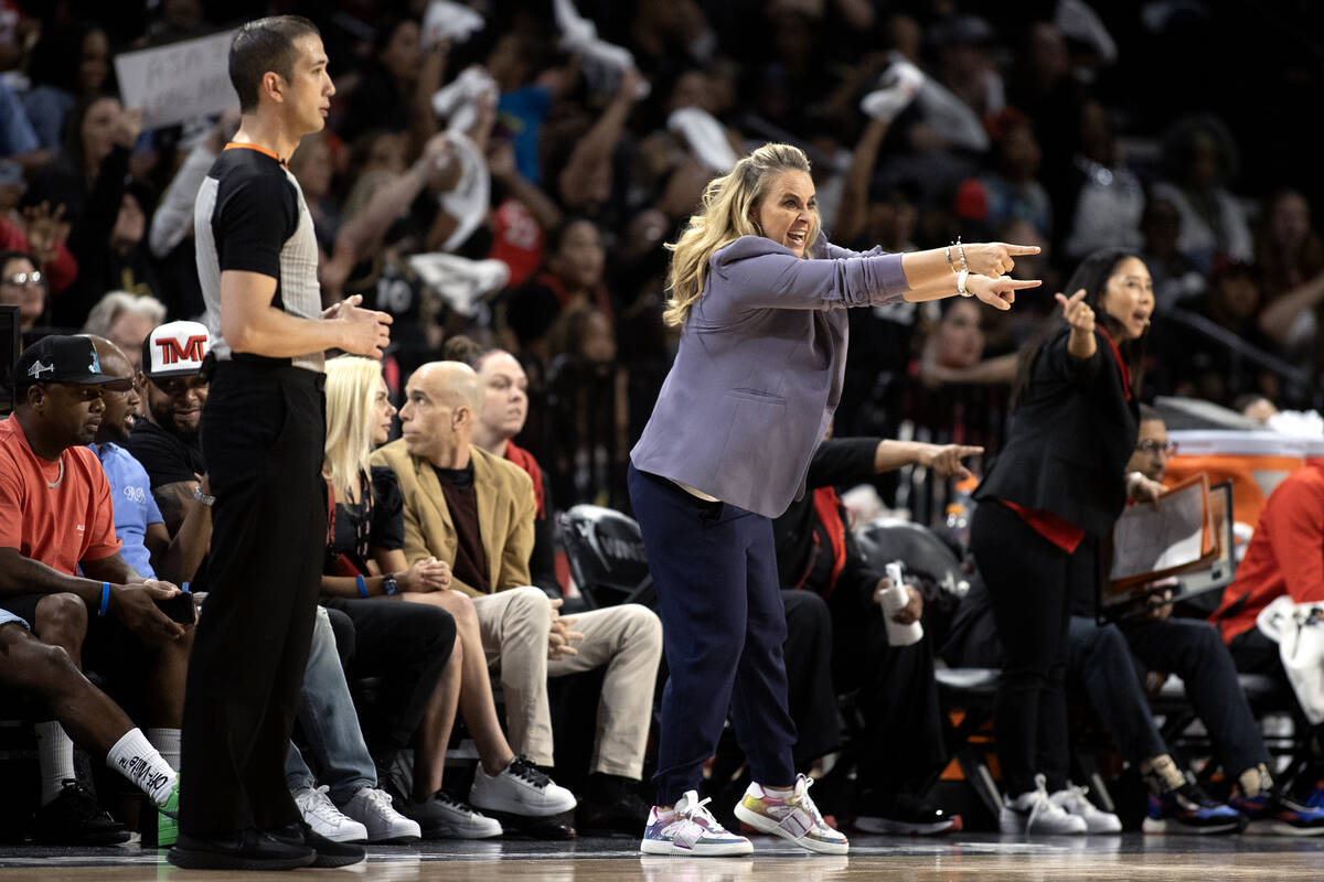 Las Vegas Aces head coach Becky Hammon shouts directions from the sidelines during the second h ...