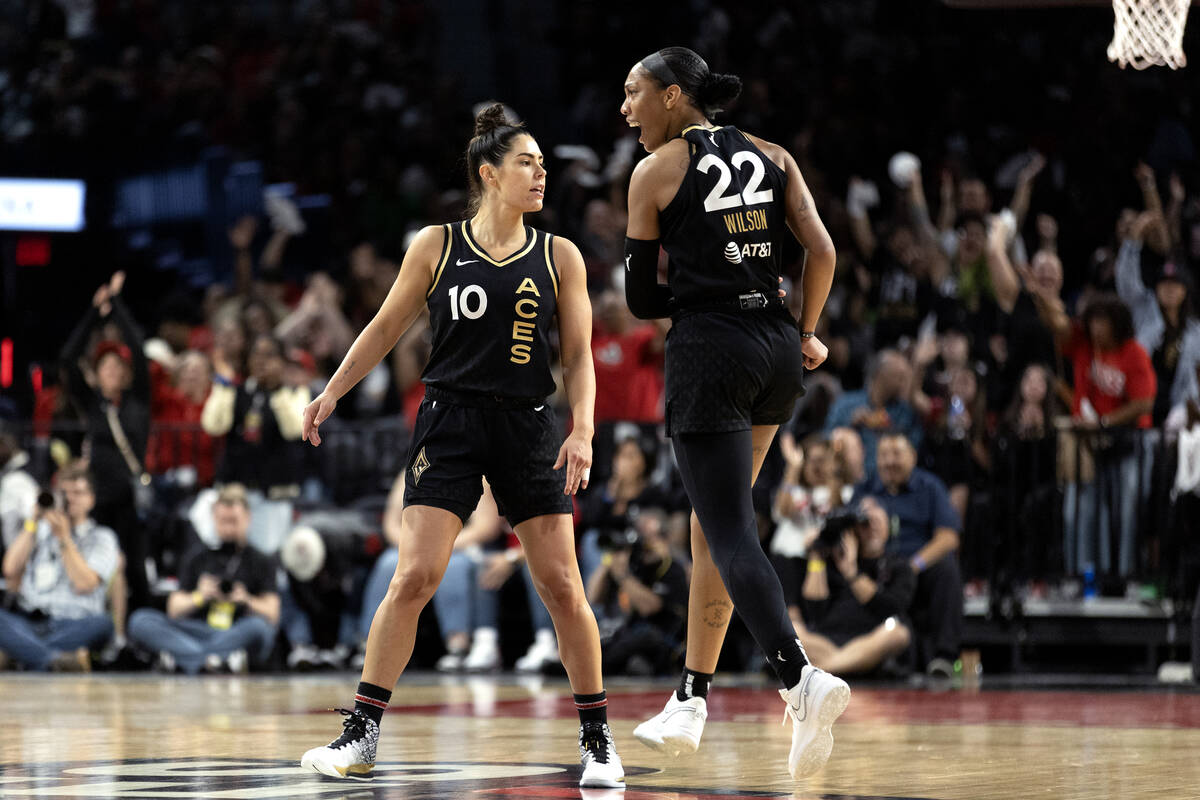 Las Vegas Aces guard Kelsey Plum (10) celebrates her three-pointer with forward A'ja Wilson (22 ...