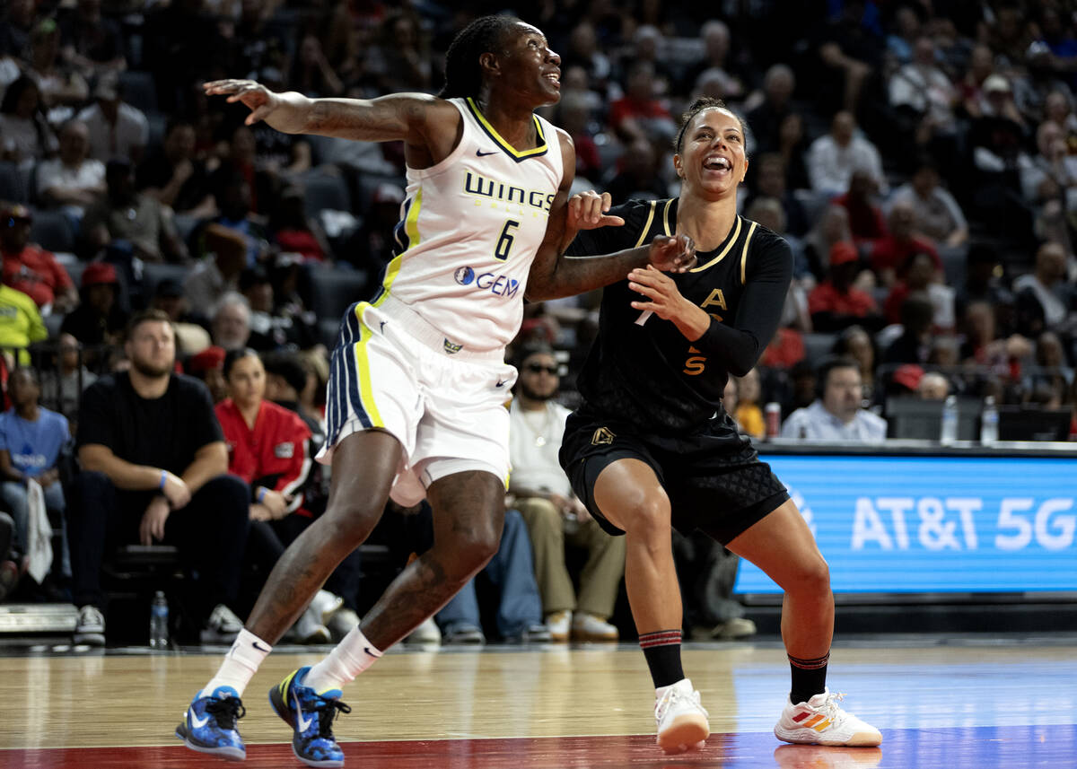 Dallas Wings forward Natasha Howard (6) and Las Vegas Aces forward Alysha Clark (7) goof off wh ...