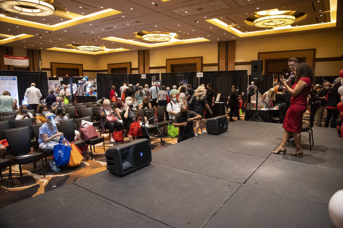 People attend the Aging Wellness Expo at Red Rock Resort in Las Vegas, Saturday, Aug. 28, 2021. ...