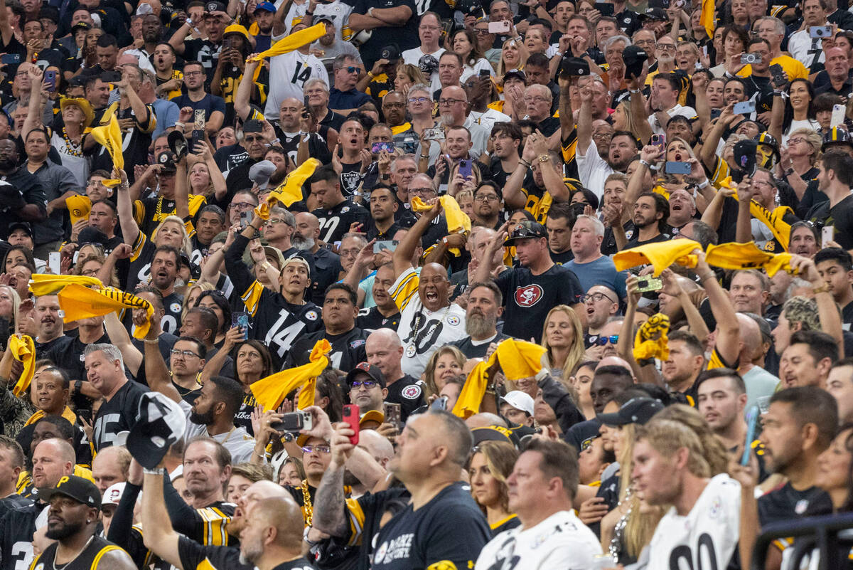 Pittsburgh Steelers fans wave their towels after during the first half an NFL game against the ...