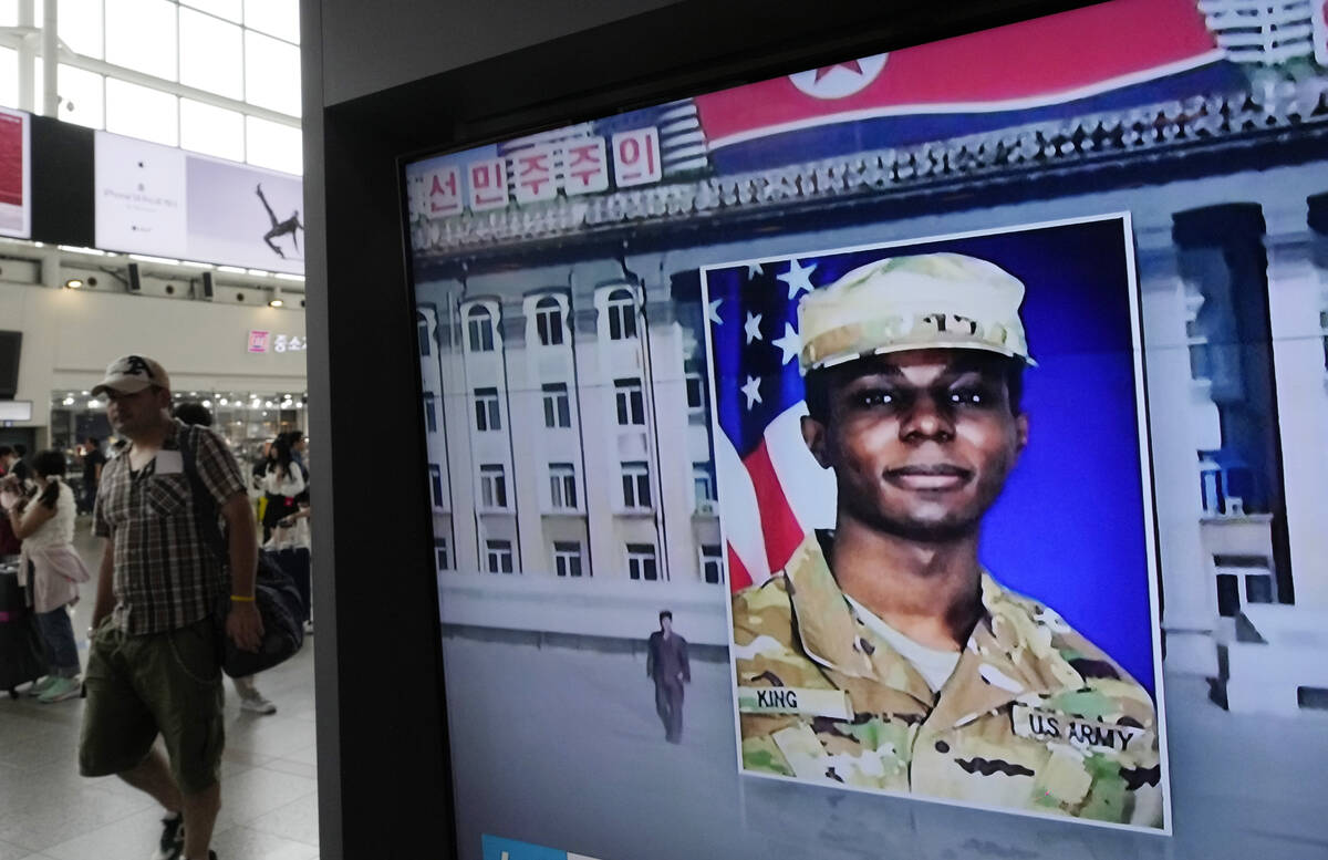 FILE - A TV screen shows a file image of American soldier Travis King during a news program at ...