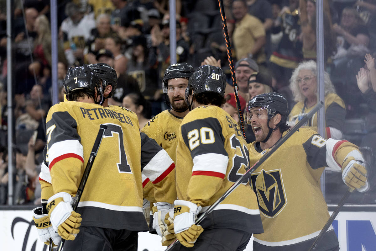 The Golden Knights gather after Knights right wing Jonathan Marchessault (81) scored on the Kin ...