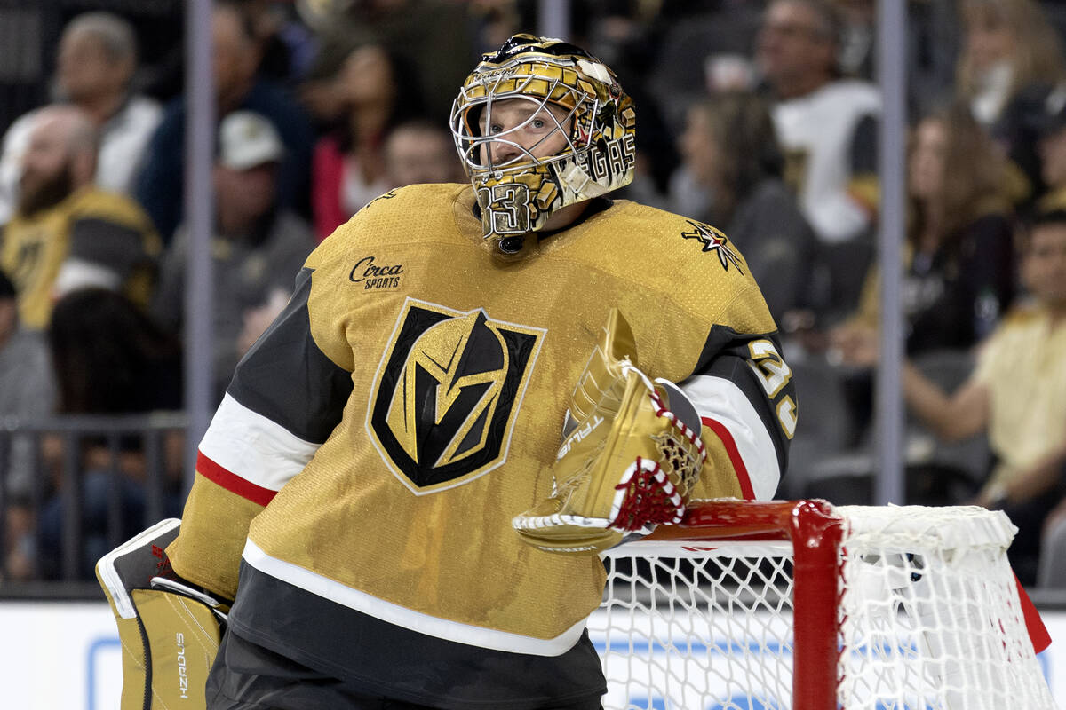 Golden Knights goaltender Adin Hill (33) waits for a fight to clear during the second period of ...