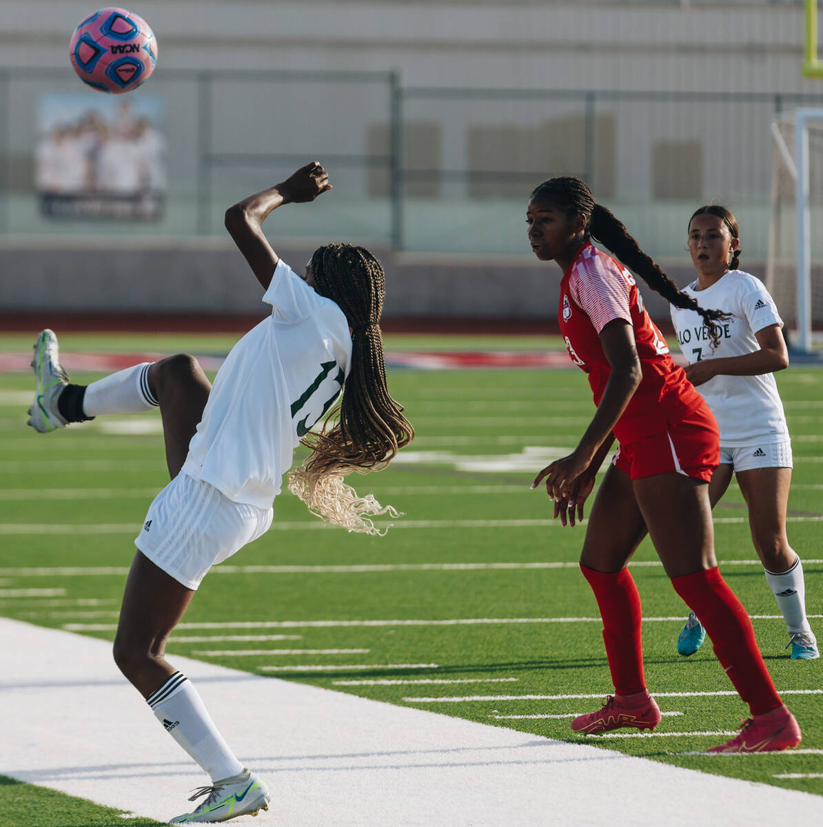 Palo Verde forward India Wilson (13) kicks the ball up to keep it in bounds during a game again ...