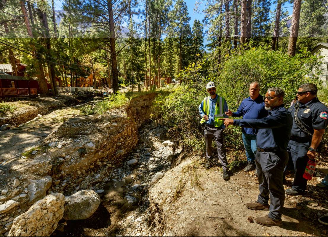 Congressman Steven Horsford, right, talks about electrical issues with officials along Aspen Av ...