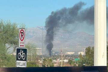 Smoke can be seen from a house fire Wednesday, Sept. 27, 2023, on the 1900 block of Kransten Dr ...