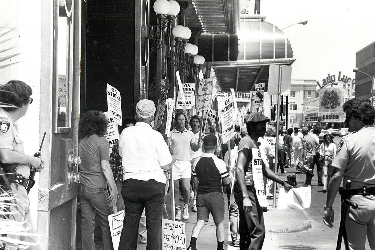 Strikers protest in front of the 4 Queens as stockholders file in for a meeting in 1984. (Las V ...
