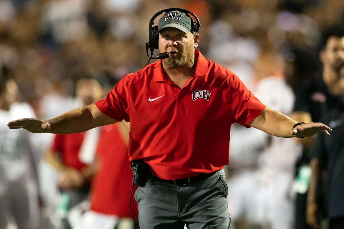 UNLV coach Barry Odom gestures from the sidelines during an NCAA college football game against ...