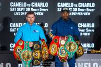 Boxers Canelo Alvarez and Jermell Charlo stand with their belts ending their final press confer ...
