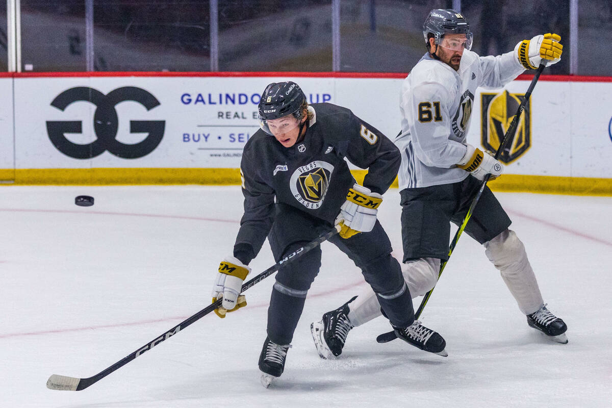 Golden Knights defenseman Kaedan Korczak (6) deflects a puck away from right wing Mark Stone (6 ...