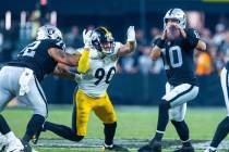 Raiders quarterback Jimmy Garoppolo (10) looks to avoid after another sack by Pittsburgh Steele ...