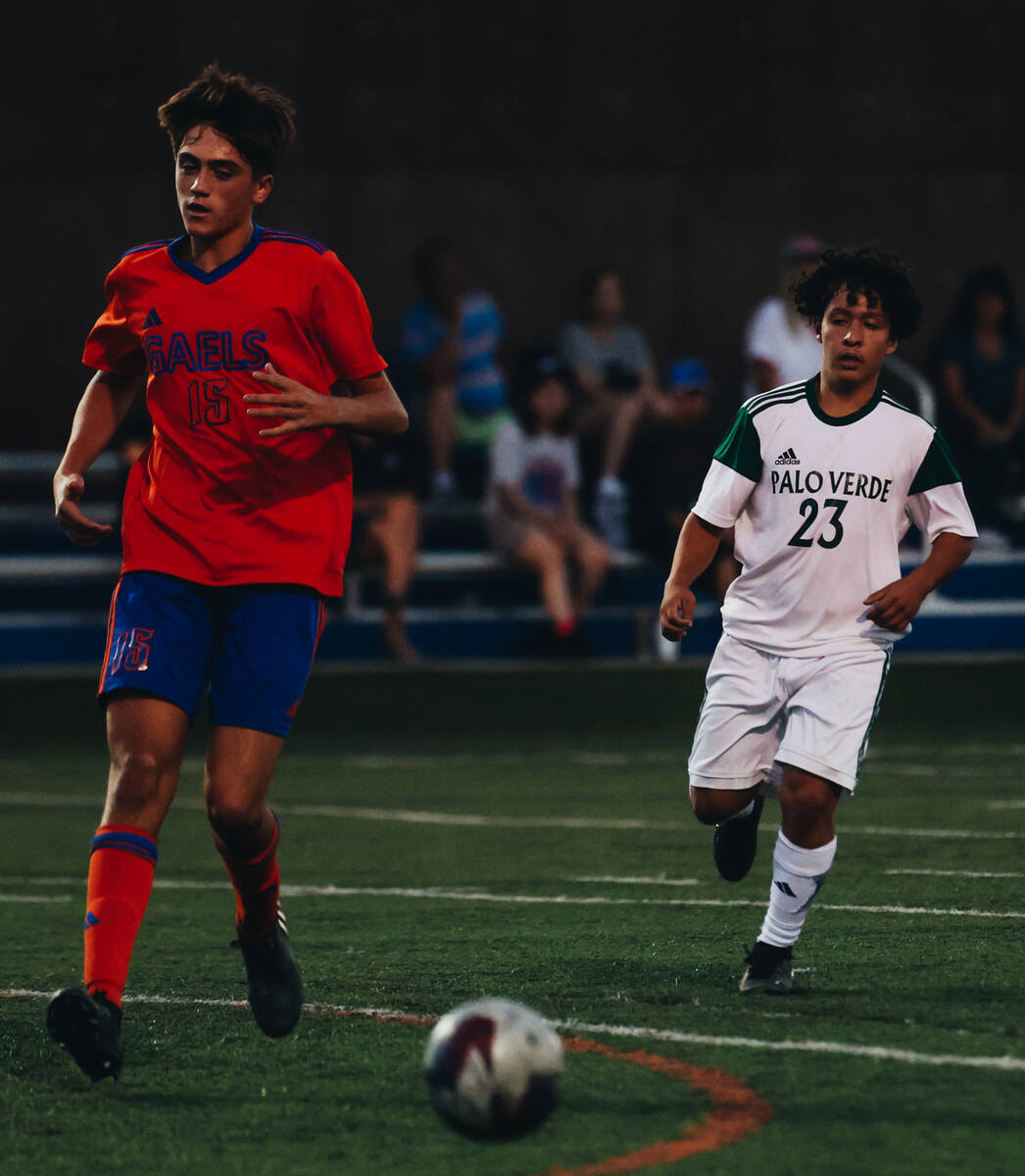 Bishop Gorman’s Massimiliano Musi (15) and Palo Verde forward Daniel Mercado (23) close ...