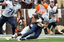 Tennessee Titans quarterback Ryan Tannehill (17) is sacked by Cleveland Browns defensive end My ...