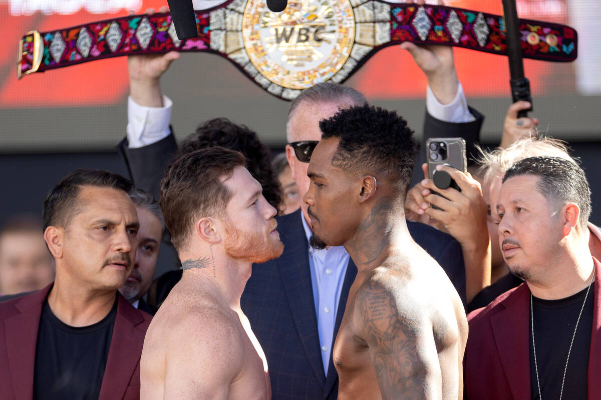 Canelo Alvarez, let, faces off with Jermell Charlo during a weigh in at Toshiba Plaza on Friday ...