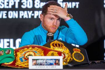 Boxer Canelo Alvarez considers a response about the upcoming fight with opponent Jermell Charlo ...
