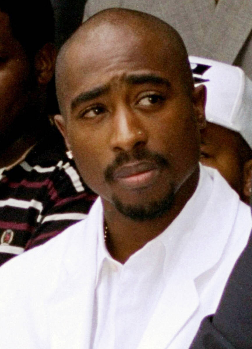 FILE - Rapper Tupac Shakur attends a voter registration event in South Central Los Angeles, Aug ...