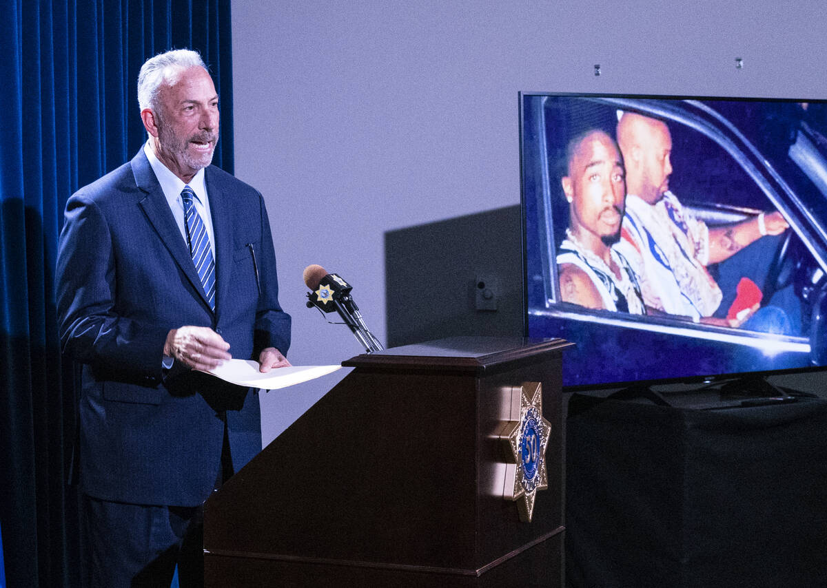 A photograph of rapper Tupac Amaru Shakur, right, is displayed as Clark County District Attorne ...