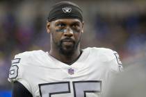 Raiders defensive end Chandler Jones (55) waits on the sideline before an NFL game against the ...