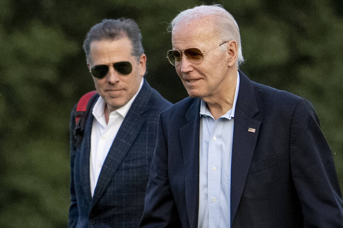 FILE - President Joe Biden, and his son Hunter Biden arrive at Fort McNair, June 25, 2023, in W ...