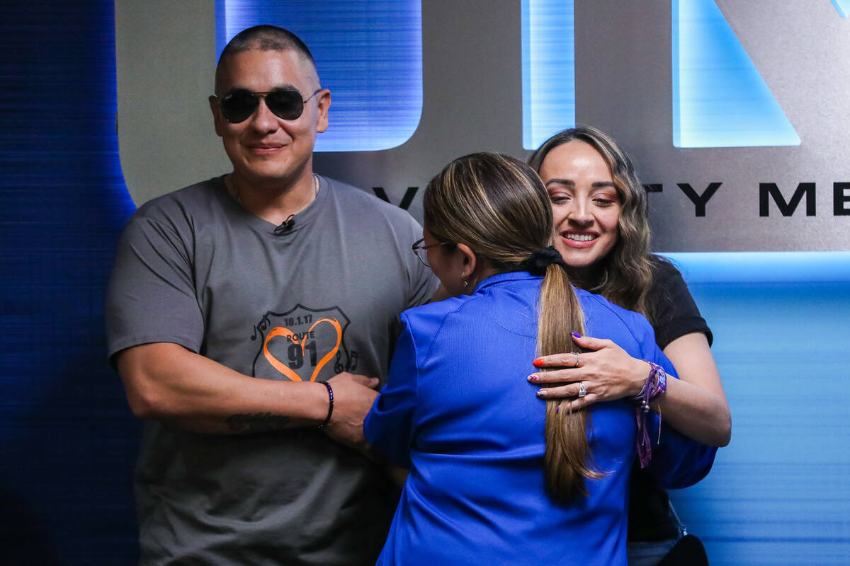 Jovanna Calzadillas, survivor of the October 1, 2017 shooting, hugs Nikki Legaspina, a nurse wh ...