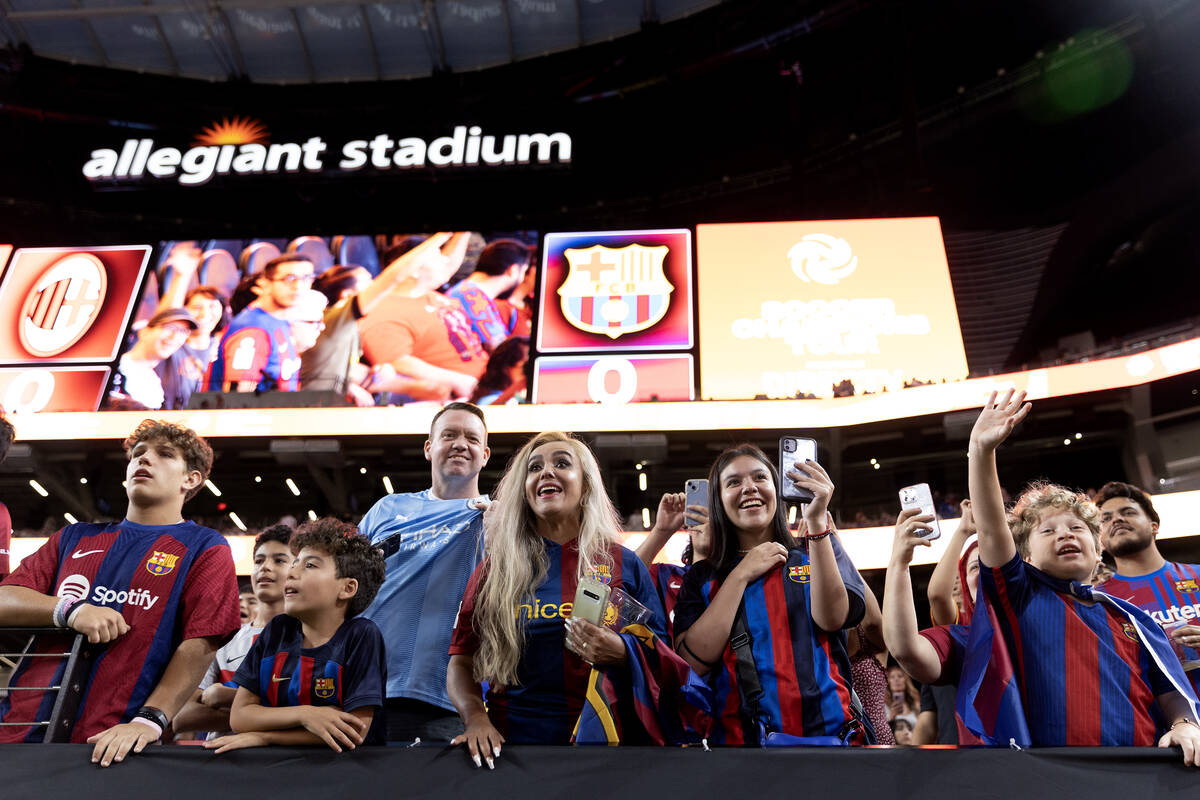 Barcelona fans cheer for their team during warmups before a Soccer Champions Tour exhibition ma ...