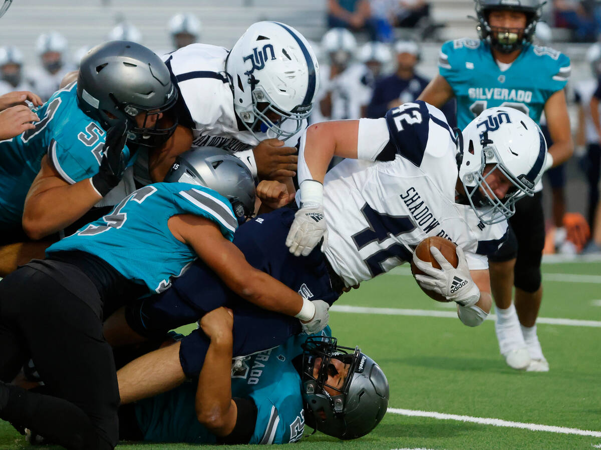 Shadow Ridge Evan Cannon (42) tackled by Silverado High defense during the first half of a hig ...