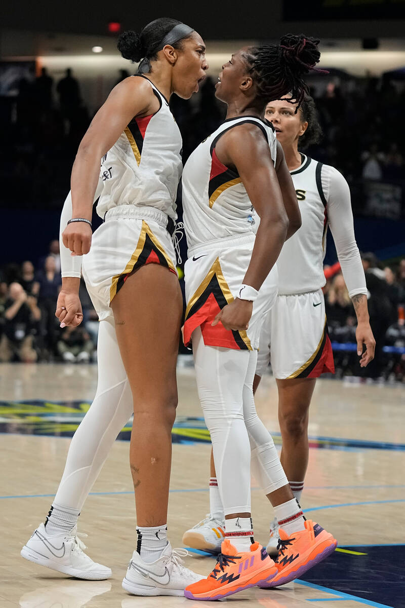 Las Vegas Aces forward A'ja Wilson, left, and guard Chelsea Gray celebrate during the second ha ...