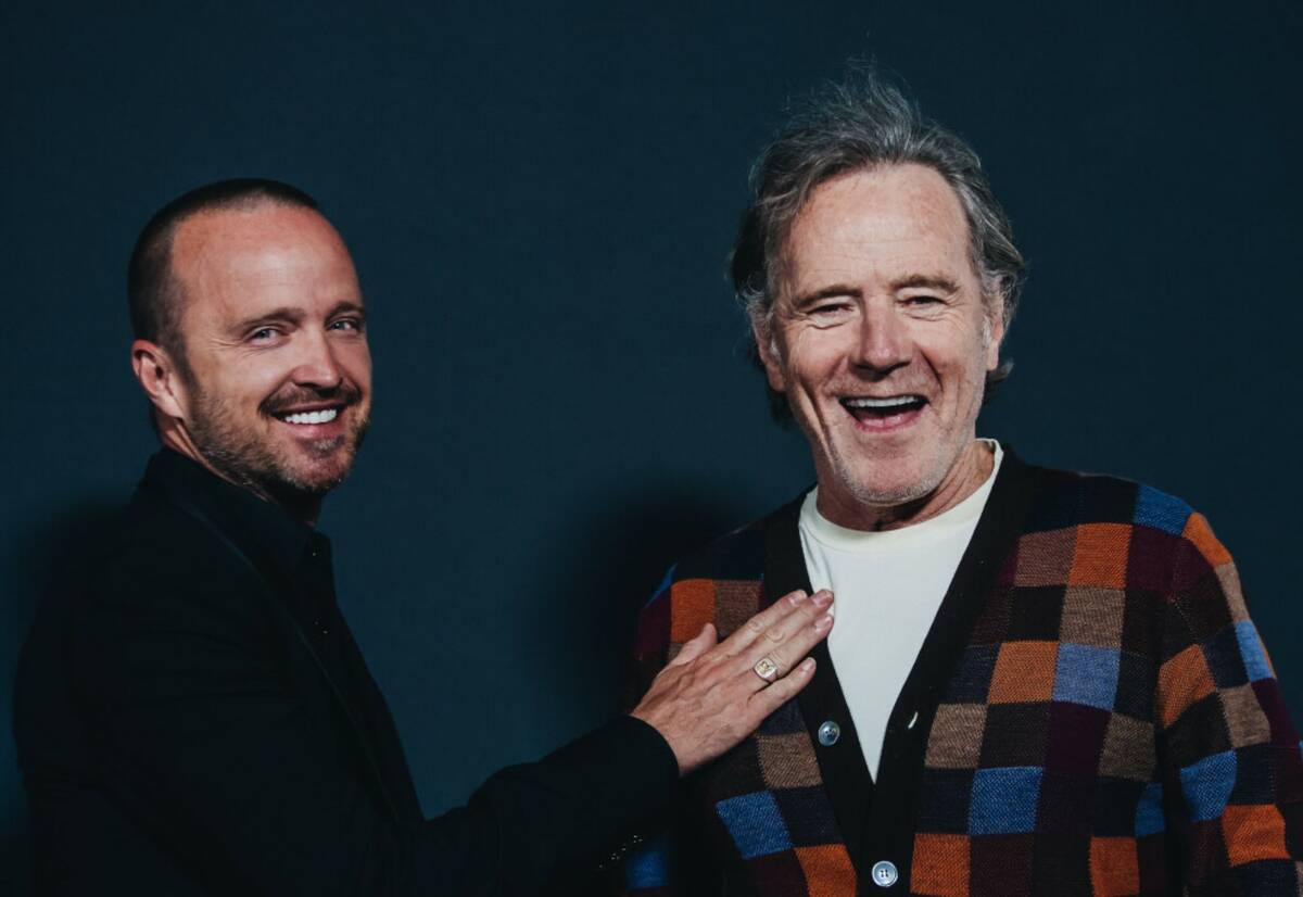 Actors Aaron Paul, left, and Bryan Cranston pose for photographs outside of the Sphere during i ...