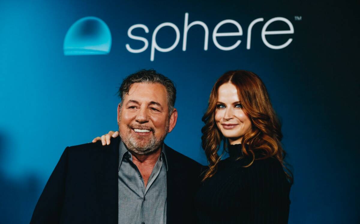 James Dolan, the executive chairman of MSG Network, left, poses for a photograph with his wife, ...