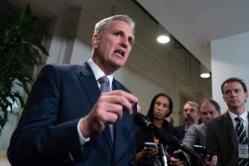 Speaker of the House Kevin McCarthy, R-Calif., talks to reporters following a closed-door meeti ...
