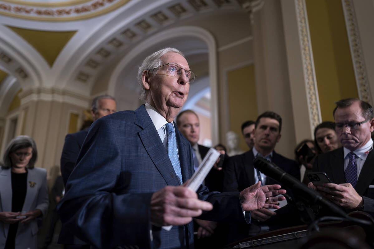 Senate Minority Leader Mitch McConnell, R-Ky., speaks to reporters following a closed-door cauc ...