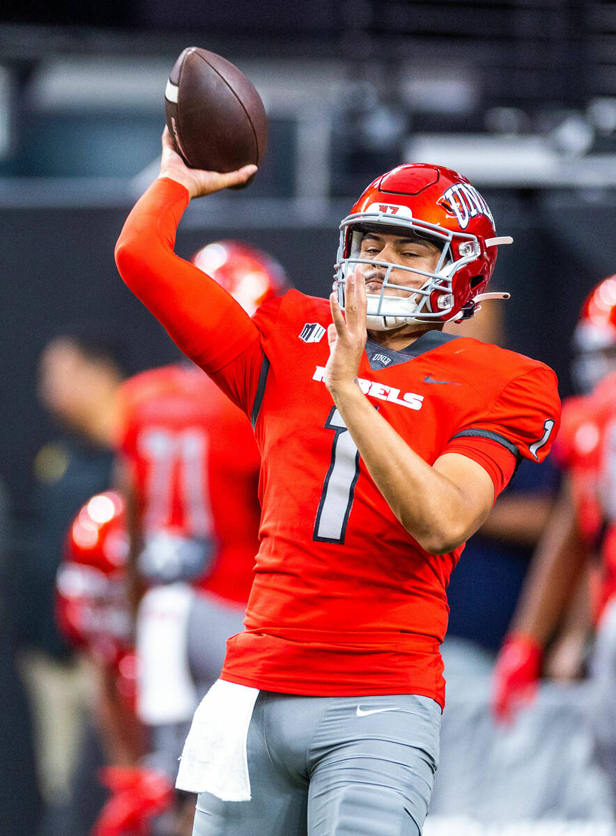 UNLV quarterback Jayden Maiava (1) tosses a pass in warmups before the first half of their NCAA ...