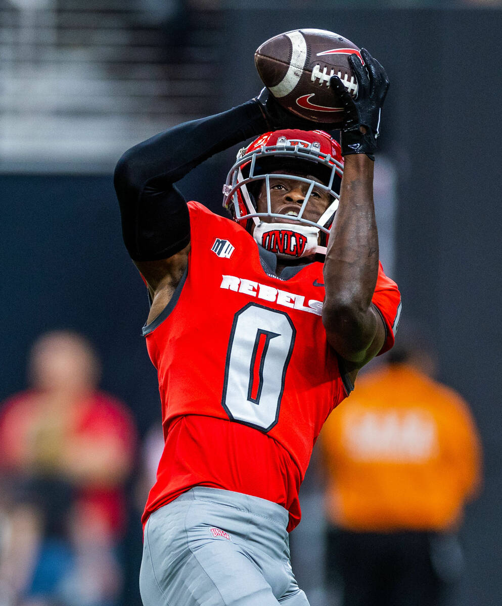 UNLV wide receiver Senika McKie (0) catches a pass in warmups before the first half of their NC ...