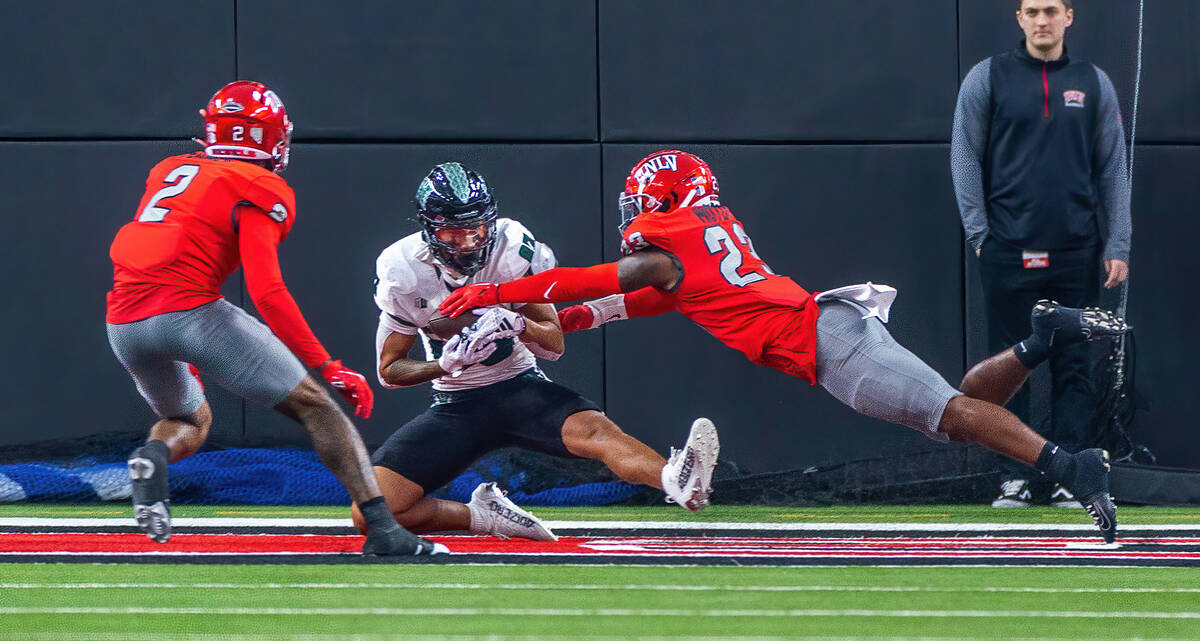 UNLV defensive back Quentin Moten (23) intercepts a touchdown pass intended for Hawaii wide rec ...