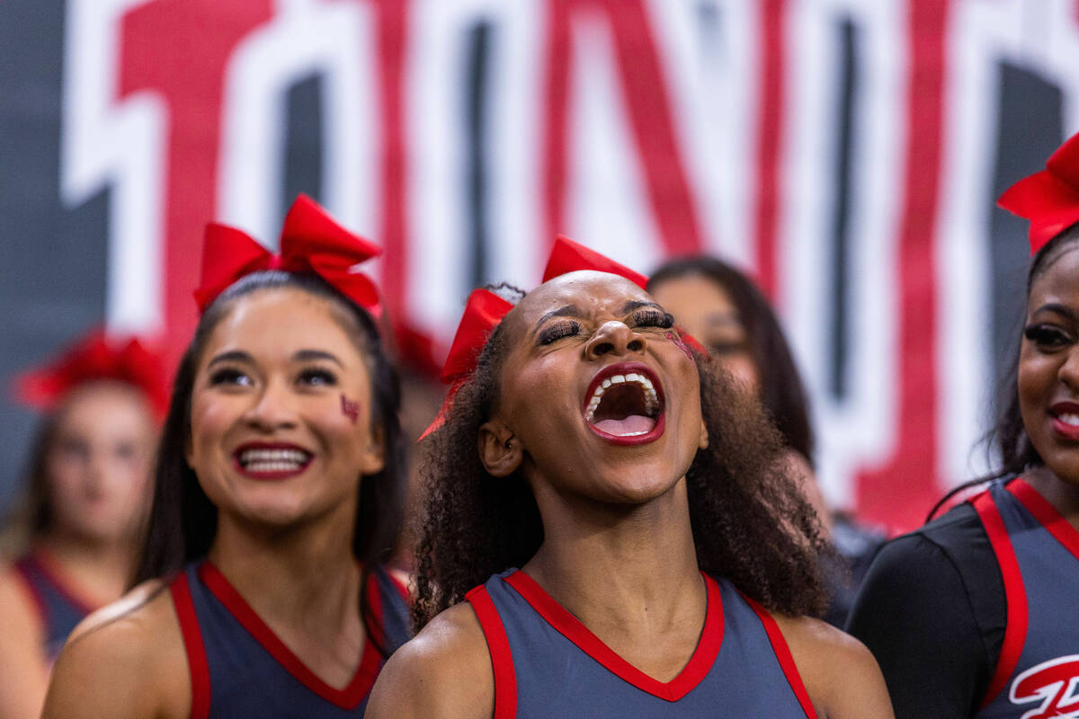 UNLV cheerleader Jayonna Haddock yells for the team joined by Zoe Solis and others during the f ...
