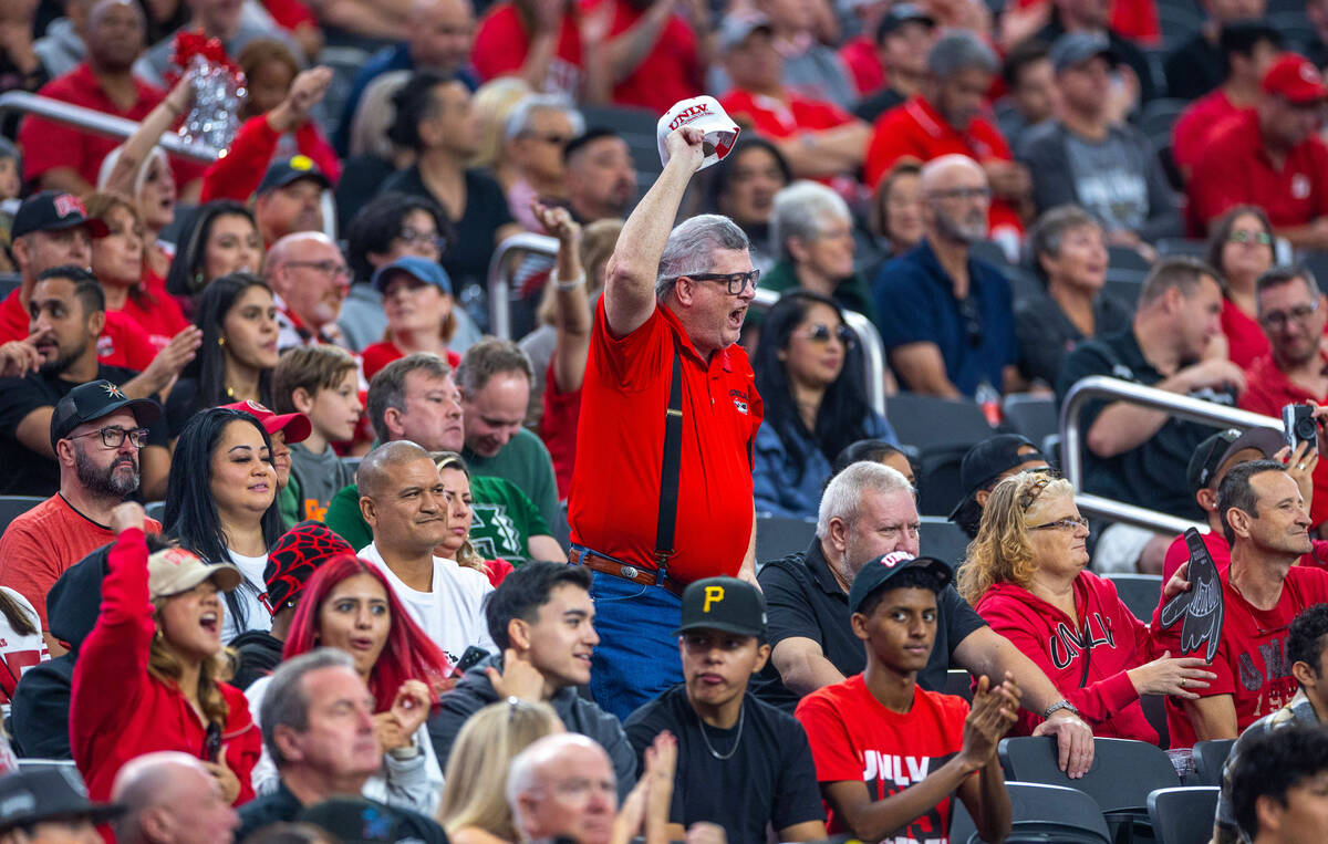 UNLV fans cheers as they score against Hawaii again during the second half of their NCAA footba ...