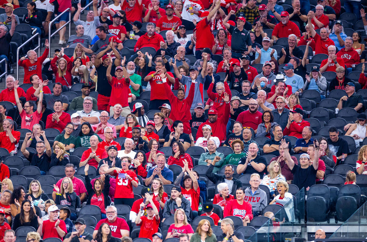 UNLV fans celebrate another score over Hawaii during the second half of their NCAA football gam ...