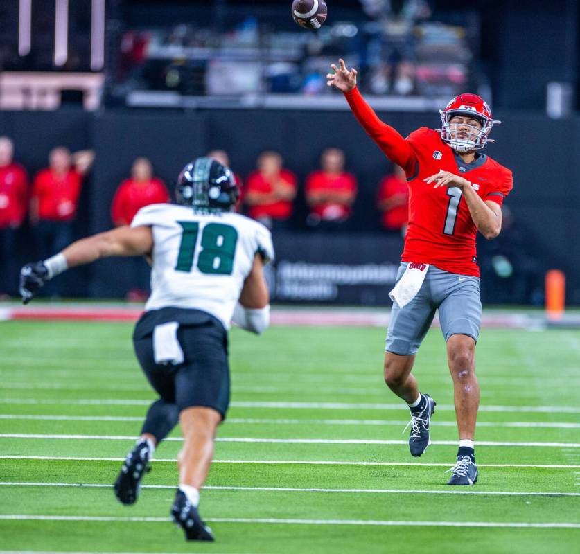 UNLV quarterback Jayden Maiava (1) gets off a pass over Hawaii linebacker Noah Kema (18) during ...