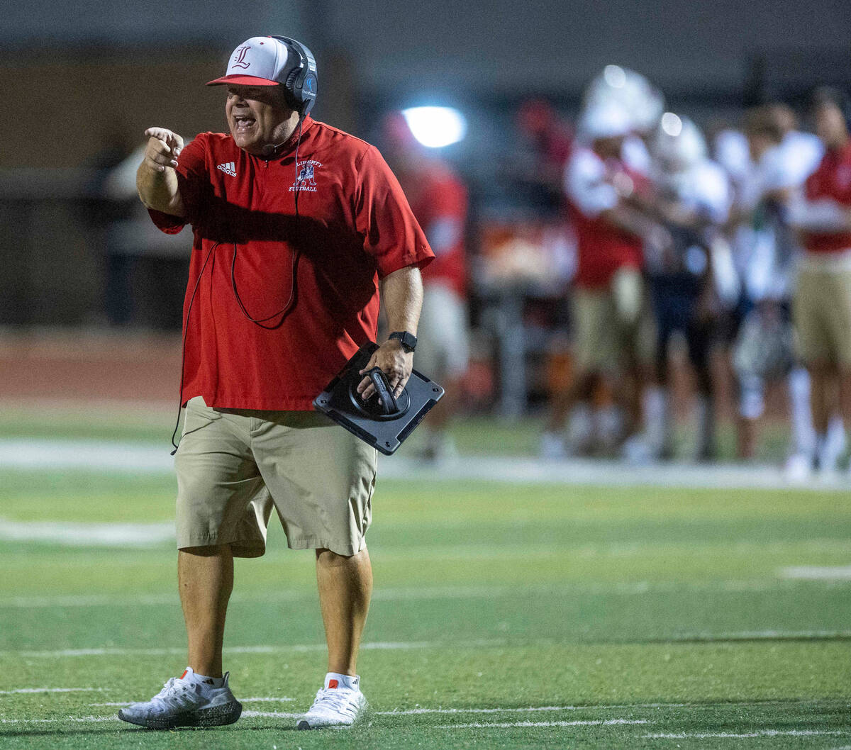 Liberty Head Coach Rich Muraco argues a penalty call versus Faith Lutheran during the first hal ...