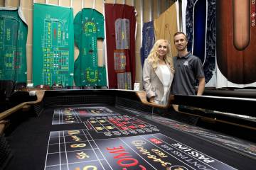 Co-owners Anne Spinetti, left, and Mikko Melander, stand for photos in a warehouse full of gami ...