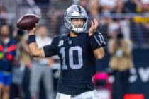 Raiders quarterback Jimmy Garoppolo (10) eyes a receiver against the Pittsburgh Steelers during ...