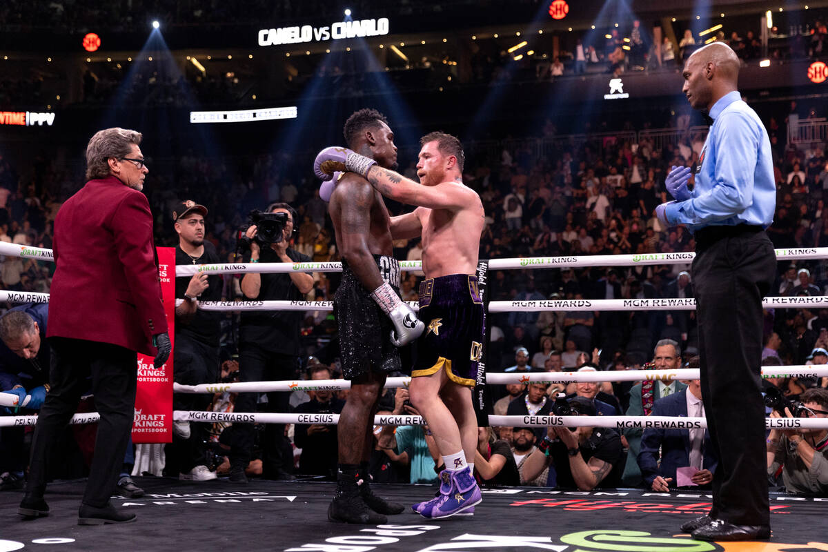 Canelo Alvarez embraces Jermell Charlo after their undisputed world super middleweight title bo ...