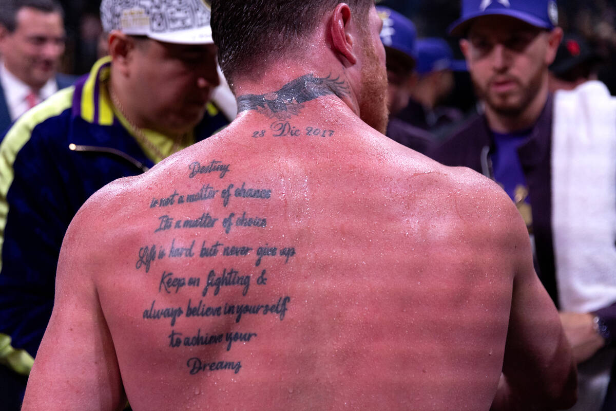 Canelo Alvarez’s back tattoo features an inspirational quote after he won an undisputed ...